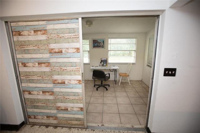 office area with light tile patterned floors