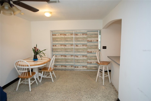 dining room featuring ceiling fan