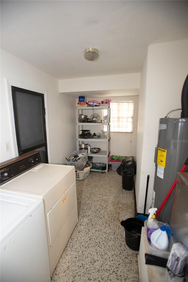 laundry area featuring washing machine and dryer and electric water heater