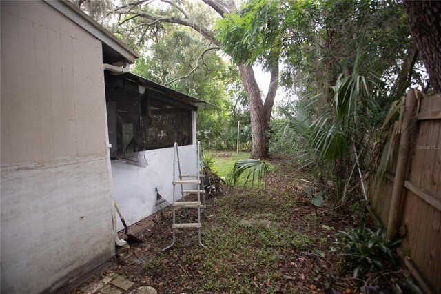 view of yard with a sunroom