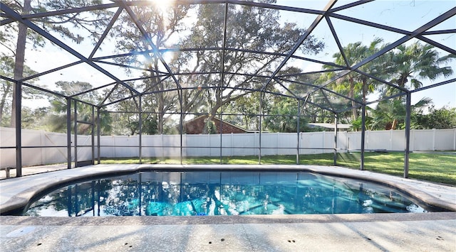 view of swimming pool with glass enclosure