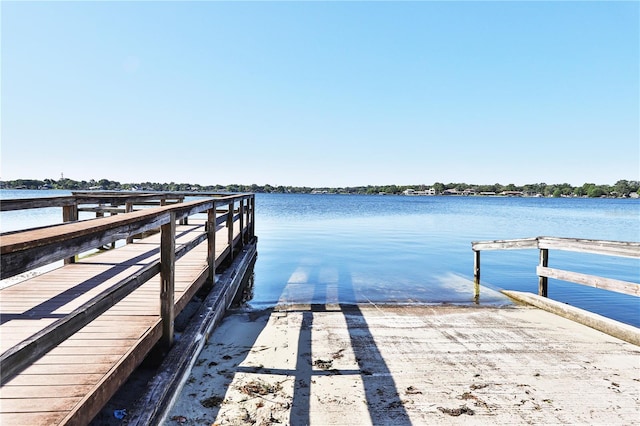 dock area with a water view