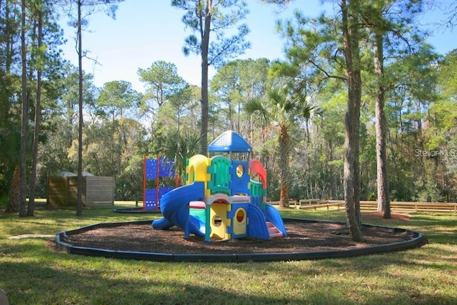 view of play area featuring a lawn