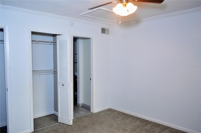 unfurnished bedroom with carpet flooring, ceiling fan, and crown molding