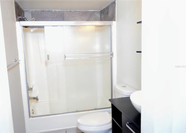 full bathroom featuring vanity, toilet, and enclosed tub / shower combo