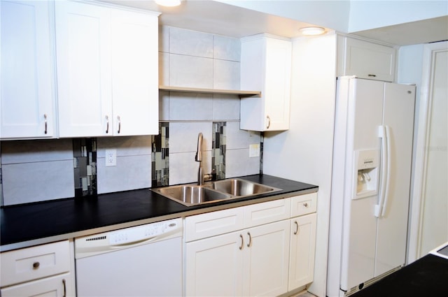 kitchen with white appliances, tasteful backsplash, white cabinetry, and sink