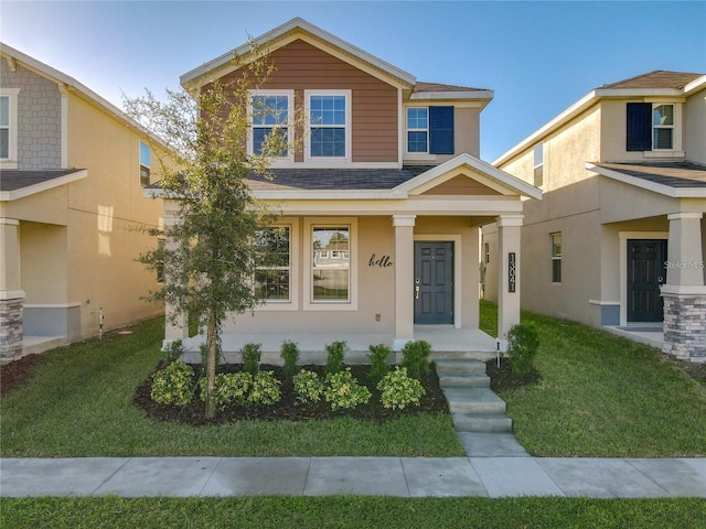 view of front facade featuring a porch and a front lawn