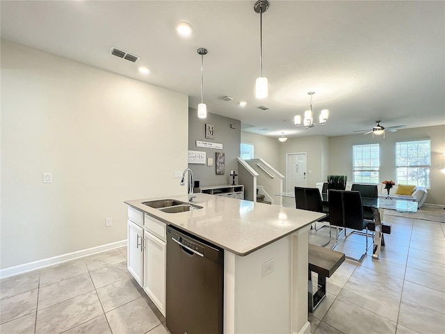 13041 Inkwell Aly, Winter Garden, FL 34787 - kitchen featuring a sink, ceiling fan with notable chandelier, an island with sink, dishwashing machine, and visible vents