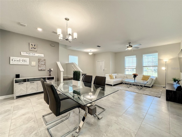 13041 Inkwell Aly, Winter Garden, FL 34787 - dining area featuring light tile patterned floors, plenty of natural light, baseboards, and ceiling fan with notable chandelier
