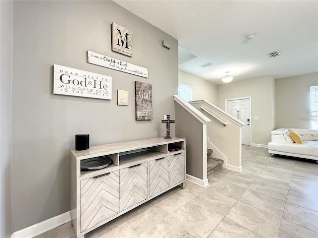 13041 Inkwell Aly, Winter Garden, FL 34787 - interior space with baseboards, visible vents, and stairway