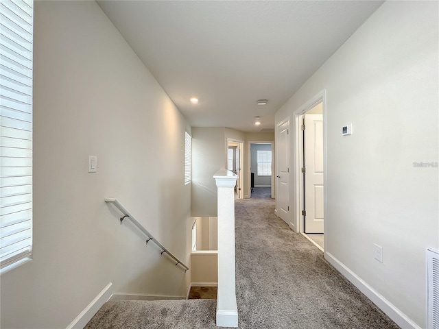 13041 Inkwell Aly, Winter Garden, FL 34787 - hallway with baseboards, carpet, and an upstairs landing