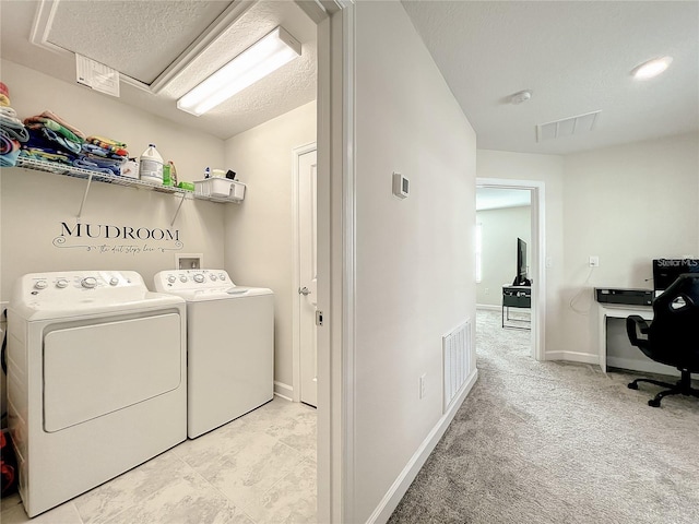13041 Inkwell Aly, Winter Garden, FL 34787 - clothes washing area with baseboards, visible vents, washer and dryer, and laundry area