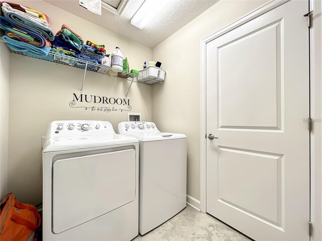 13041 Inkwell Aly, Winter Garden, FL 34787 - clothes washing area featuring separate washer and dryer, a textured ceiling, and laundry area