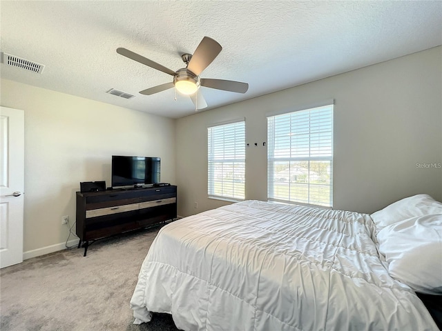13041 Inkwell Aly, Winter Garden, FL 34787 - bedroom featuring visible vents, a ceiling fan, baseboards, and light carpet