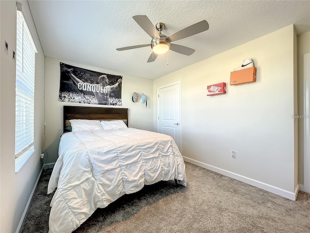 13041 Inkwell Aly, Winter Garden, FL 34787 - carpeted bedroom with a ceiling fan, baseboards, and a textured ceiling
