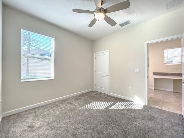13041 Inkwell Aly, Winter Garden, FL 34787 - unfurnished bedroom featuring baseboards, visible vents, and carpet