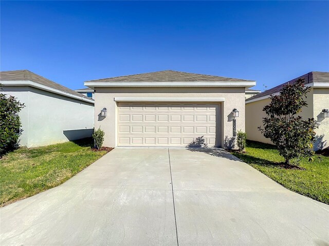 13041 Inkwell Aly, Winter Garden, FL 34787 - view of front of house with stucco siding and concrete driveway