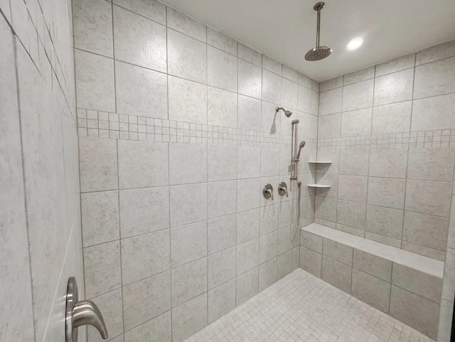 bathroom featuring a tile shower