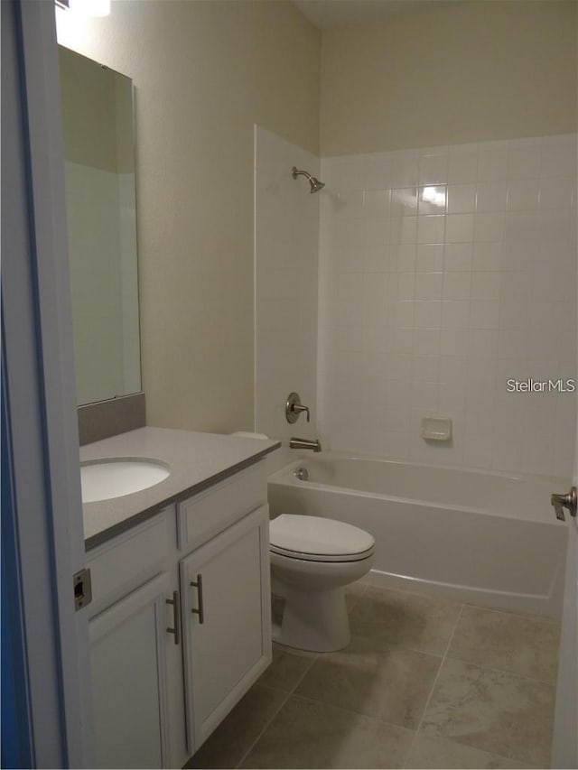 full bathroom featuring tub / shower combination, vanity, toilet, and tile patterned floors