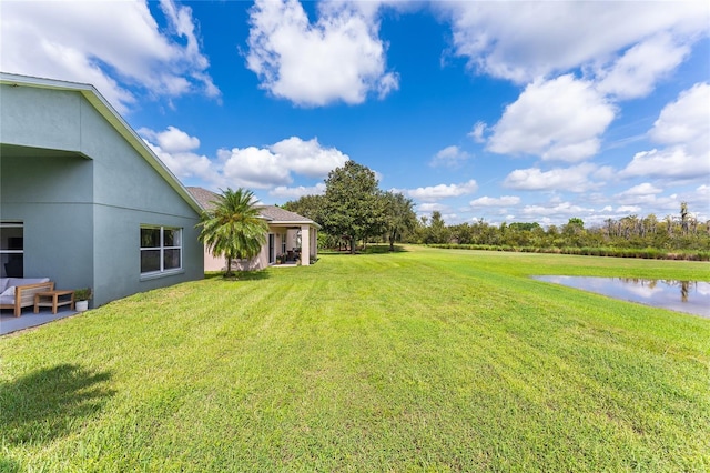 view of yard with a water view