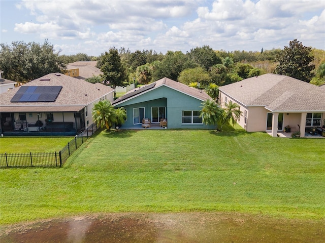 exterior space featuring solar panels, a yard, and a patio area