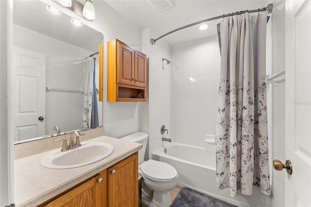 full bathroom with vanity, toilet, and shower / bath combo