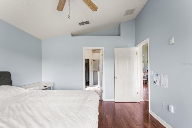 bedroom featuring lofted ceiling, ceiling fan, dark wood-type flooring, and a textured ceiling