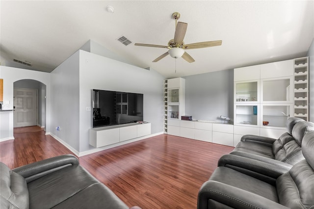 living room with ceiling fan, hardwood / wood-style flooring, and lofted ceiling