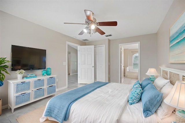 tiled bedroom featuring ceiling fan, a closet, and connected bathroom