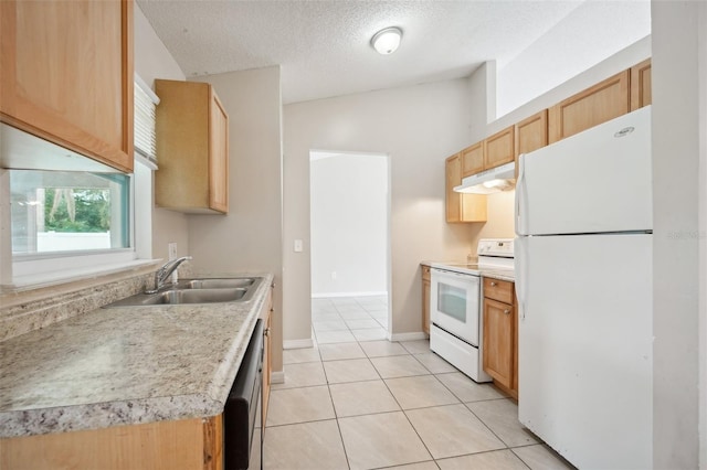 kitchen with white appliances, light brown cabinetry, sink, lofted ceiling, and a textured ceiling