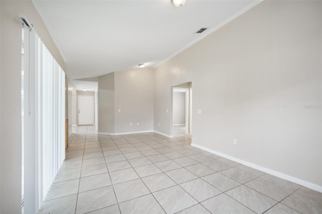 spare room featuring light tile patterned floors