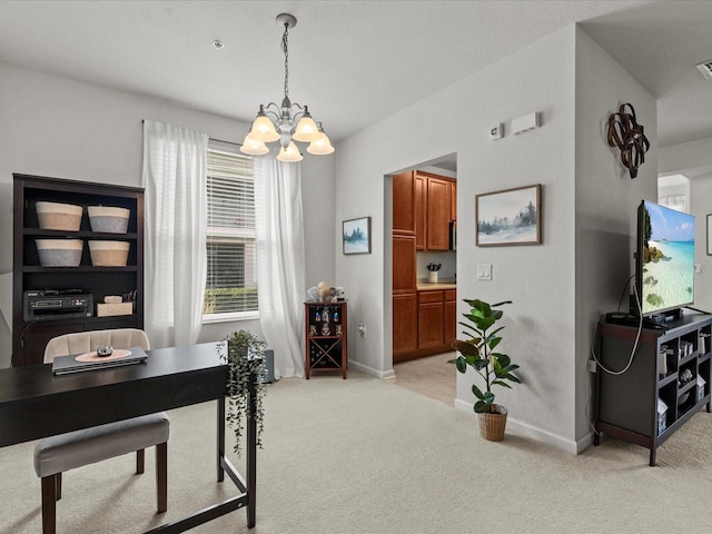 office with a notable chandelier and light carpet