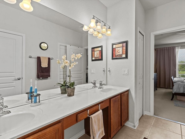 bathroom with tile patterned floors and vanity