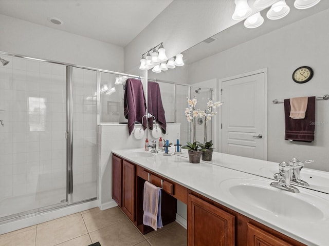 bathroom featuring walk in shower, tile patterned floors, and vanity