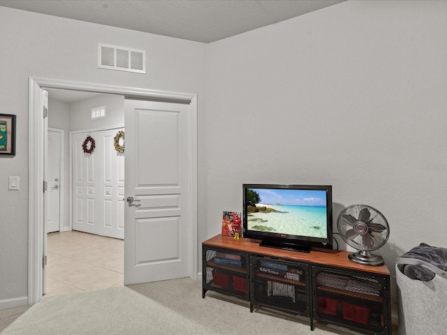 living room featuring light carpet