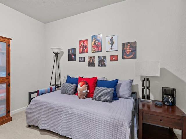 bedroom featuring light colored carpet