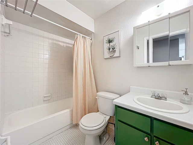 full bathroom featuring toilet, vanity, tile patterned floors, and shower / tub combo