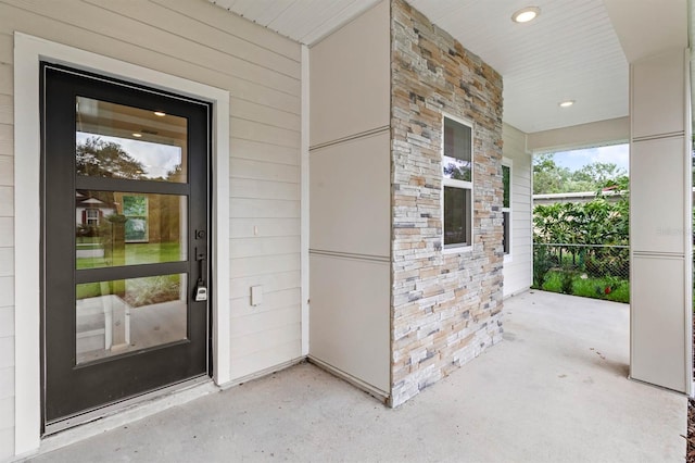 634 Burch Ave, Winter Garden, FL 34787 - property entrance featuring stone siding and covered porch