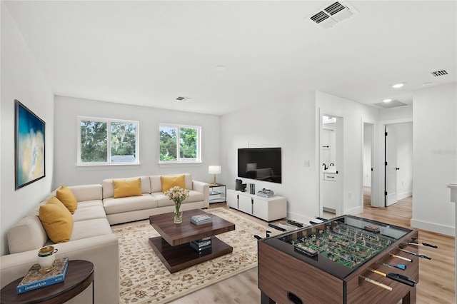 living room with light hardwood / wood-style floors