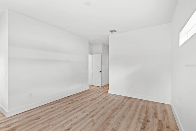 unfurnished room featuring light hardwood / wood-style flooring