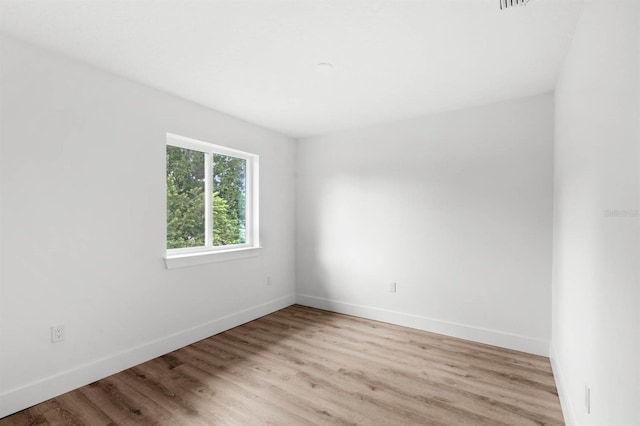 empty room with light wood-type flooring