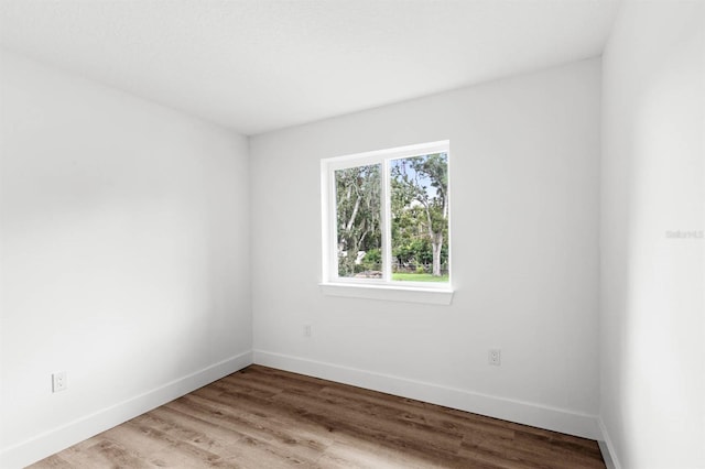 spare room with light hardwood / wood-style floors