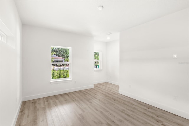 634 Burch Ave, Winter Garden, FL 34787 - spare room featuring wood finished floors, baseboards, and recessed lighting