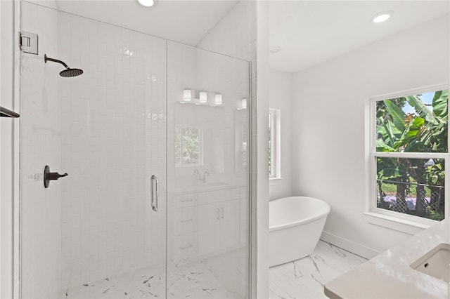 634 Burch Ave, Winter Garden, FL 34787 - bathroom with a stall shower, a soaking tub, vanity, marble look tiles, and recessed lighting