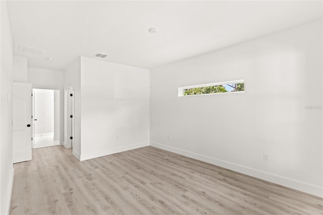 634 Burch Ave, Winter Garden, FL 34787 - spare room with light wood-style floors and baseboards
