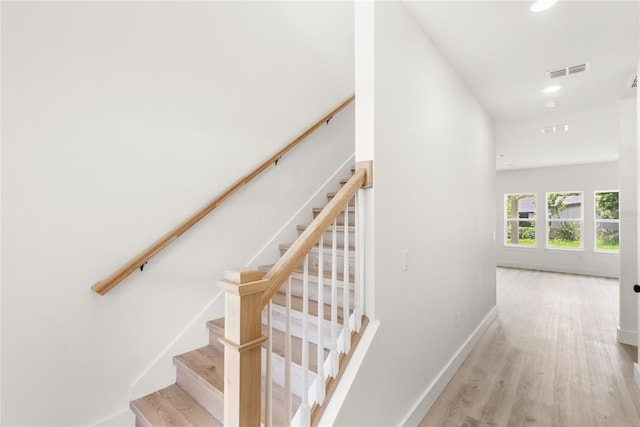 634 Burch Ave, Winter Garden, FL 34787 - staircase featuring wood finished floors, baseboards, and recessed lighting
