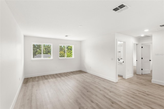 634 Burch Ave, Winter Garden, FL 34787 - unfurnished room featuring light wood-style flooring, baseboards, and recessed lighting