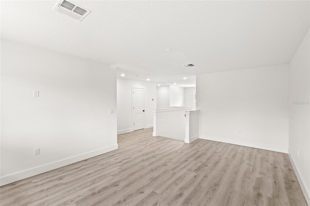 634 Burch Ave, Winter Garden, FL 34787 - unfurnished living room with recessed lighting, light wood-style flooring, and baseboards