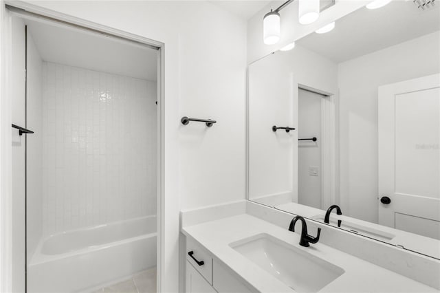 634 Burch Ave, Winter Garden, FL 34787 - bathroom featuring vanity, washtub / shower combination, and tile patterned flooring