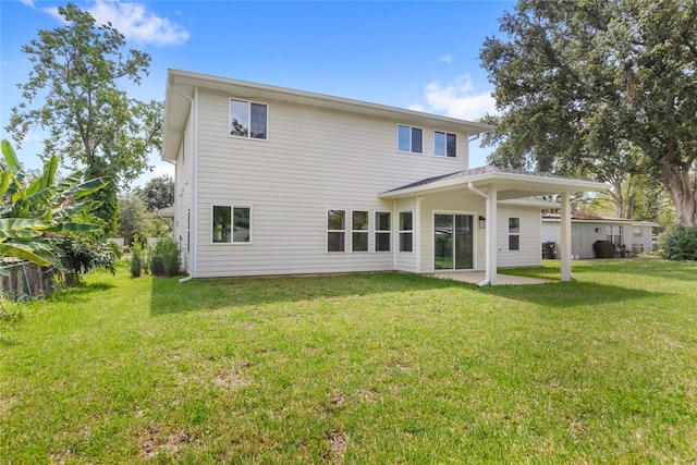 634 Burch Ave, Winter Garden, FL 34787 - back of house with a yard and a patio